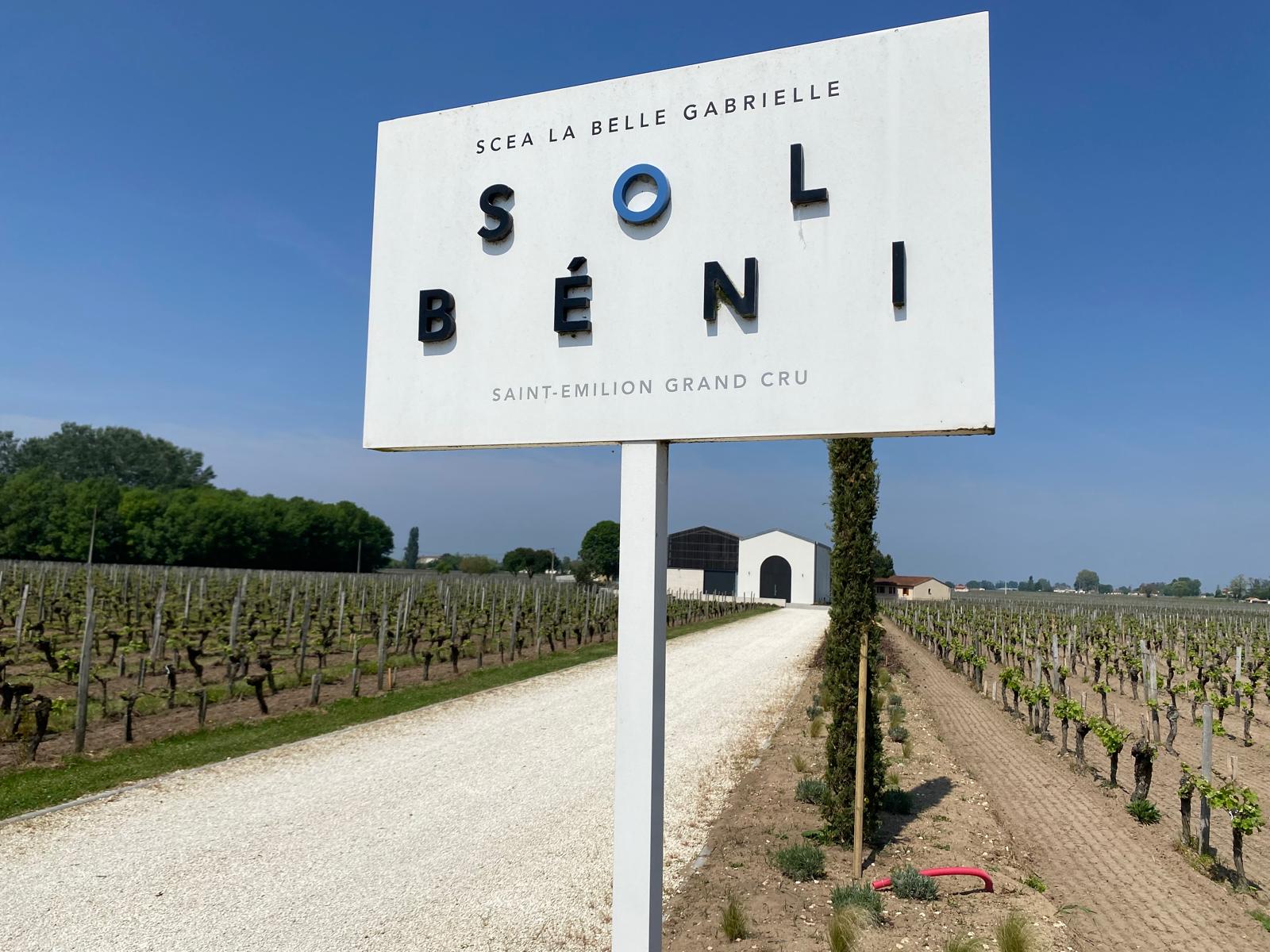 Sol Béni signboard at the Saint-Émilion Grand Cru estate, vines and winery behind